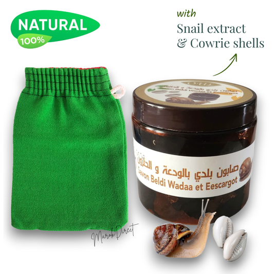 Green exfoliating glove and jar with snail extract and cowrie shells on a white background